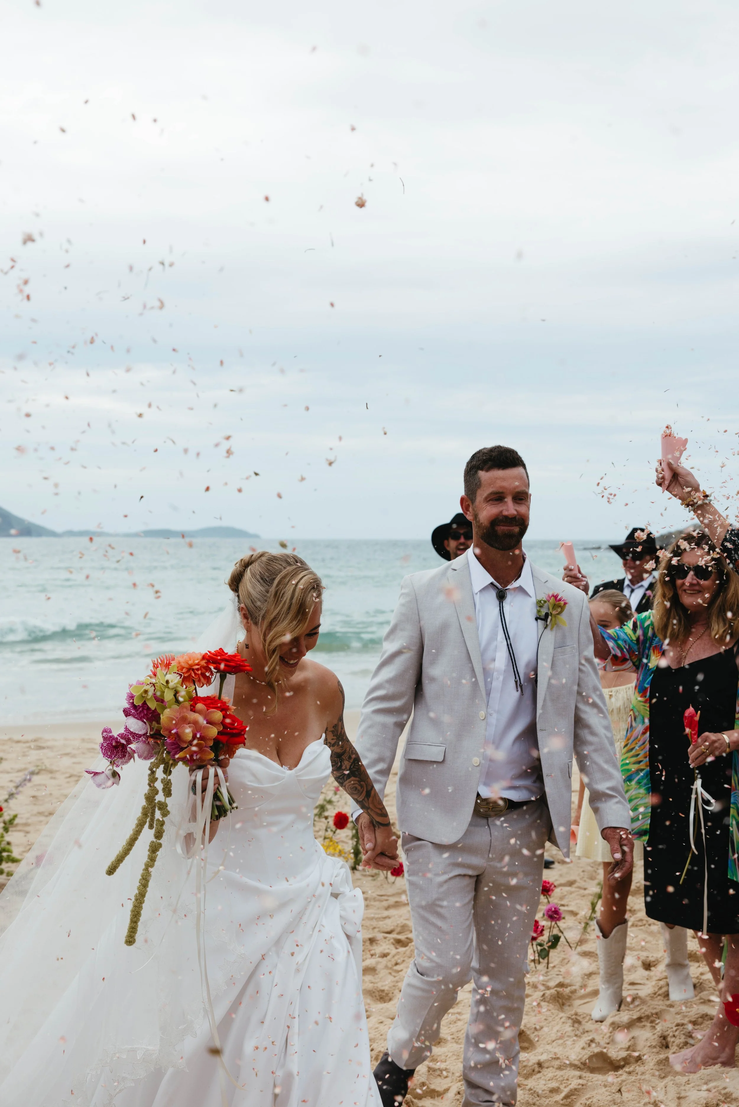 Confetti moment for bride and groom at a Barrington Coast beach wedding, NSW