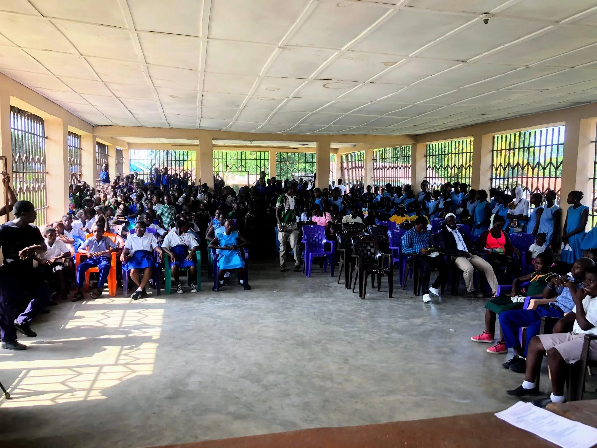 Community gathering in the court house in Tikonko, Sierra Leone