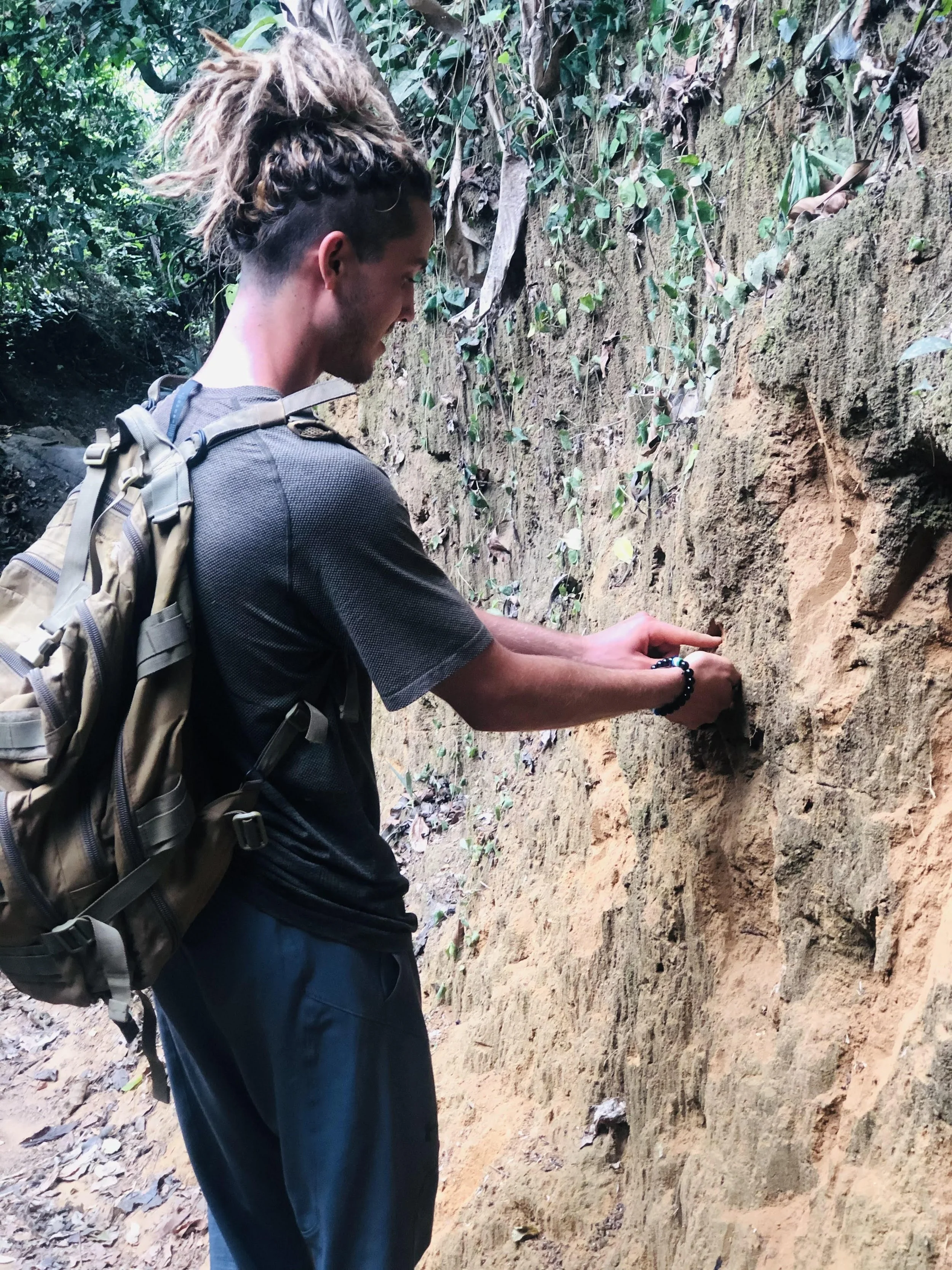 President of Growing the Grassroots inspecting soil in Sebeun Tarbema, Sierra Leone