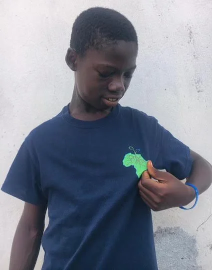 A child that was sent back to school wearing a Growing the Grassroots shirt