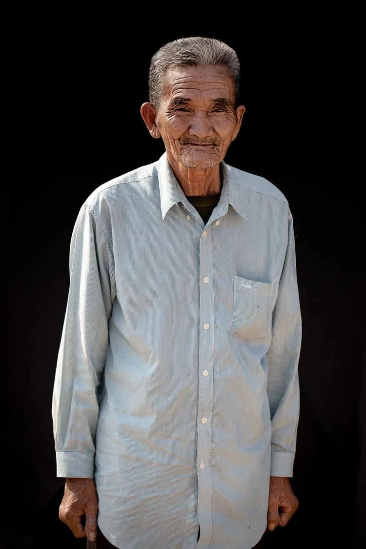 Varum age 76: "I live alone. I used to be married but my wife died about 20 years ago from sickness. We had twelve children but ten of them died in the war. Our two living children now have children of their own. They come visit me on holidays. Durin