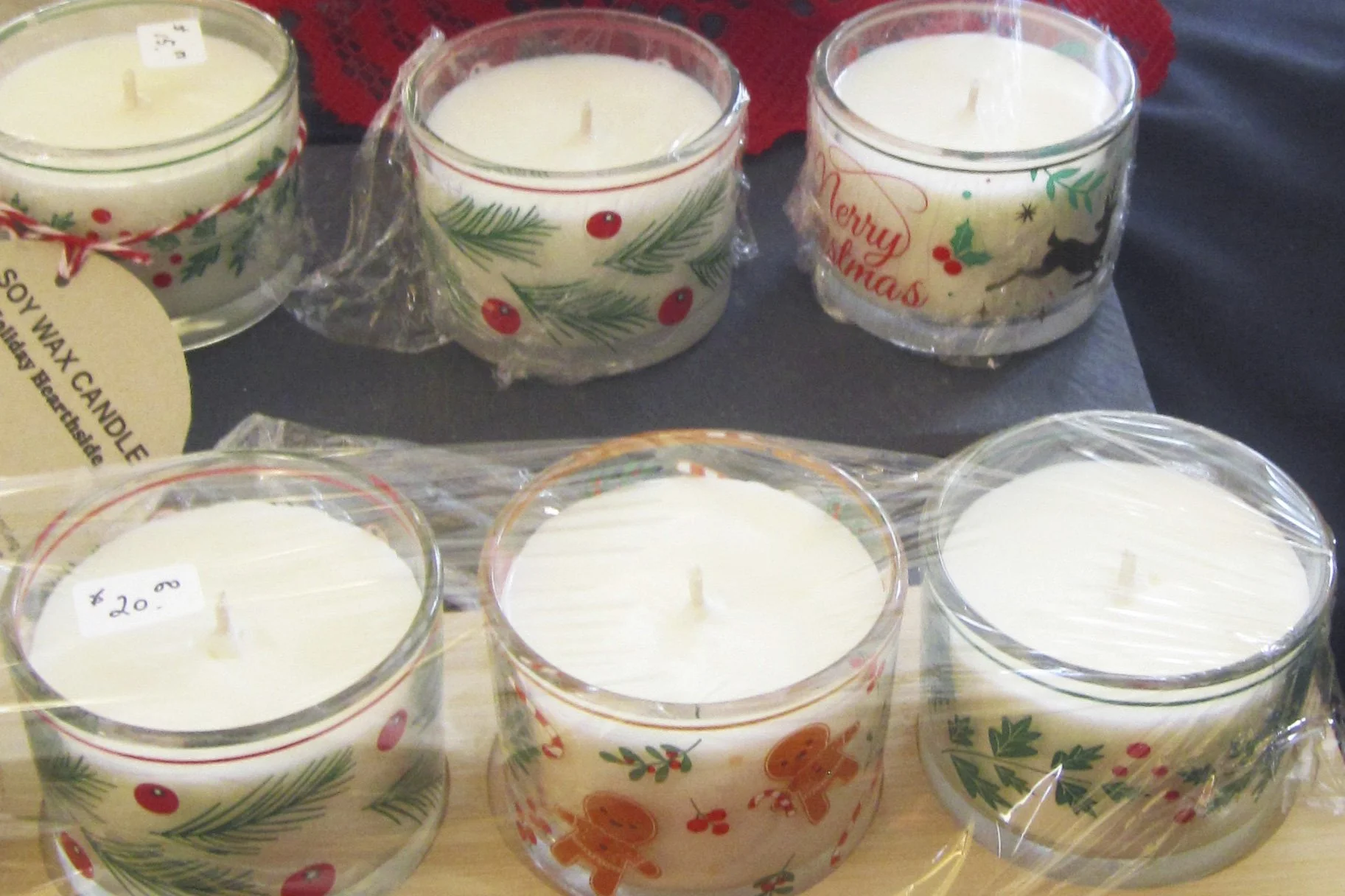 Soy candles, with a variety  of aromas. 
$8 to $10 each. Repurposed glassware. 
Created by Marilyn Nairn. 