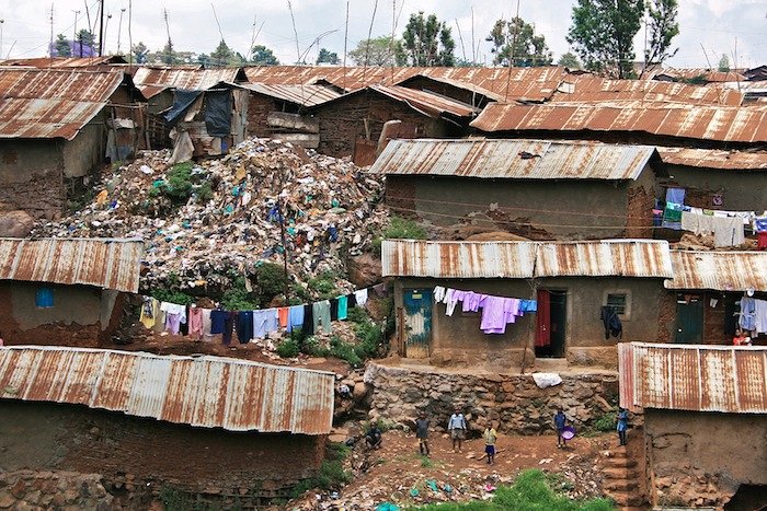 Kibera mud-walled shacks with tin roofs