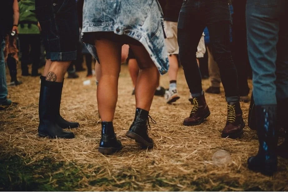 People in cowboy boots square dancing