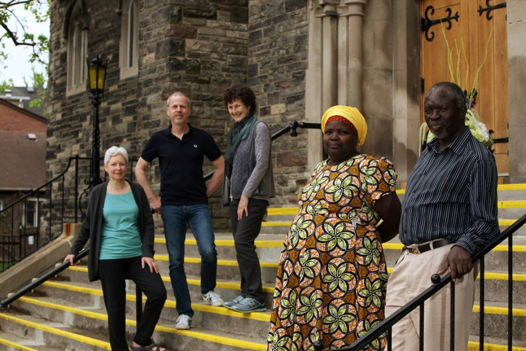 Three Village of Love Canada members with Leonora and Andrew Obara of Kijiji Cha Upendo on the church steps