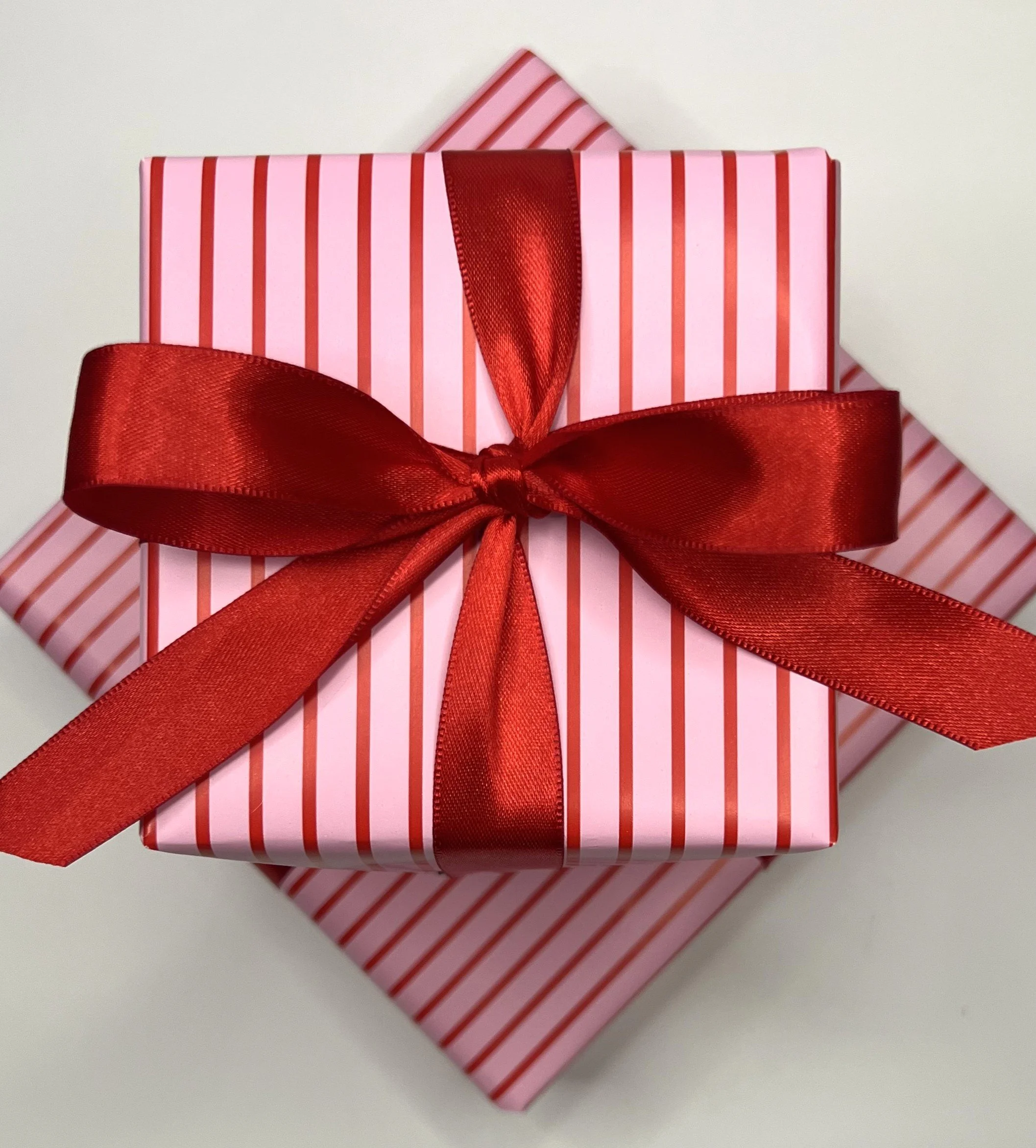 Wrapping Valentine's red satin bow.jpeg