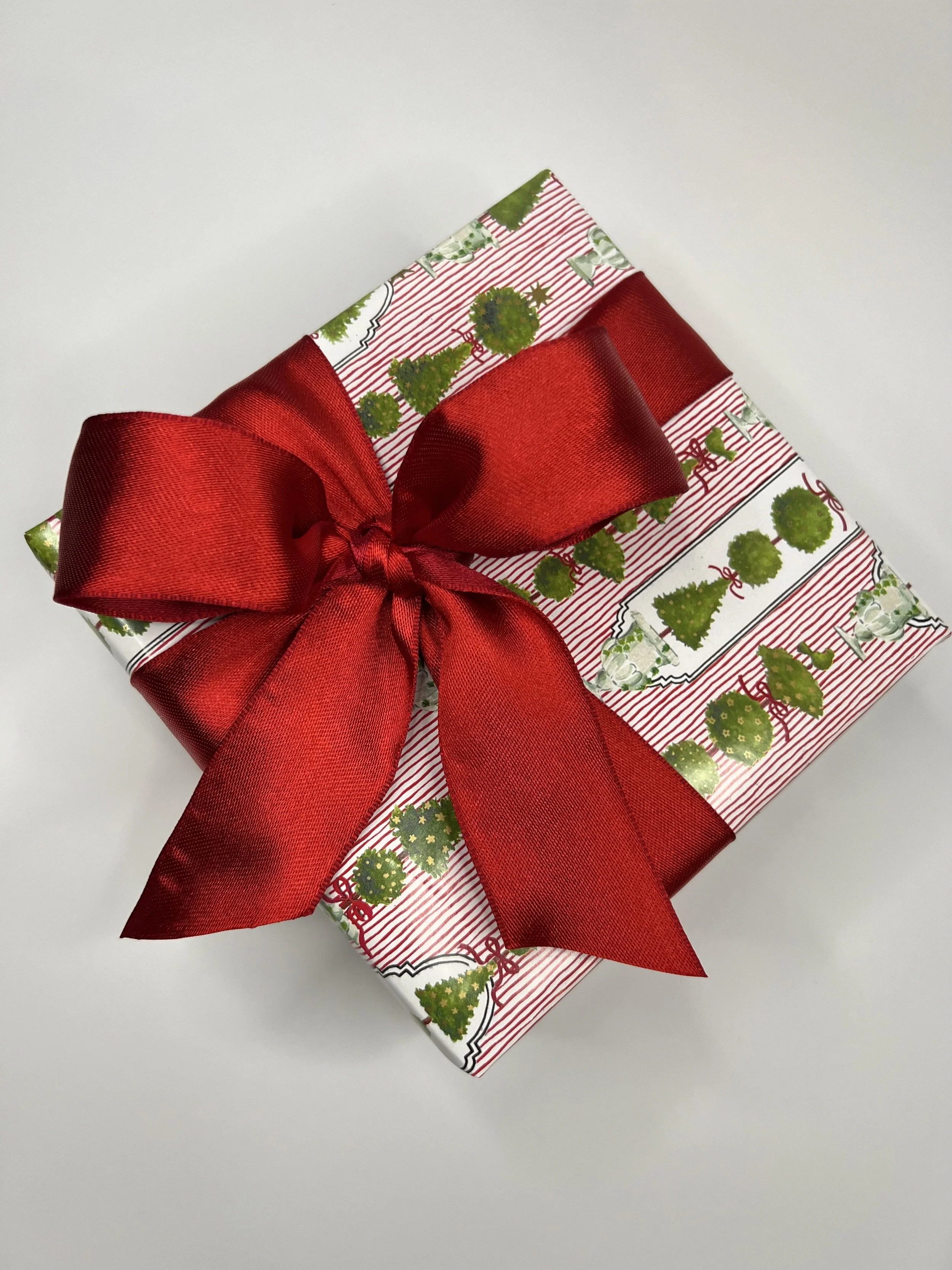 Wrapping boxwood red bow.jpeg
