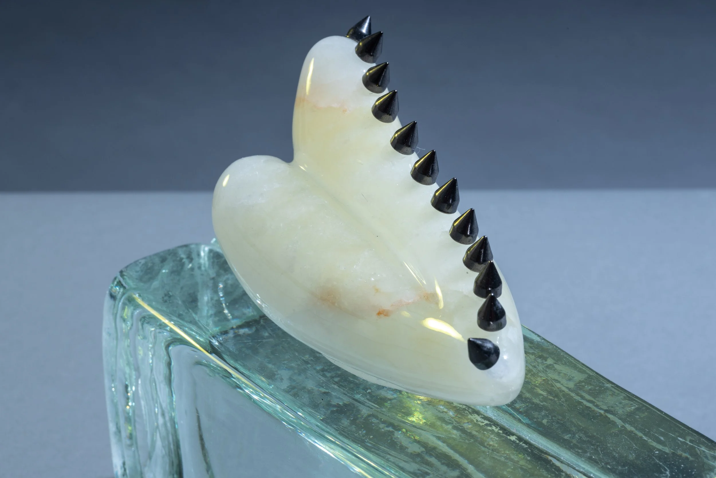 Tidbit No.2 (detail), 2023, Alabaster, glass brick, ink, metal spikes, epoxy resin, 6 ½ x 7 ½ x 3 (Photography: Richard R. Vallon, Jr)