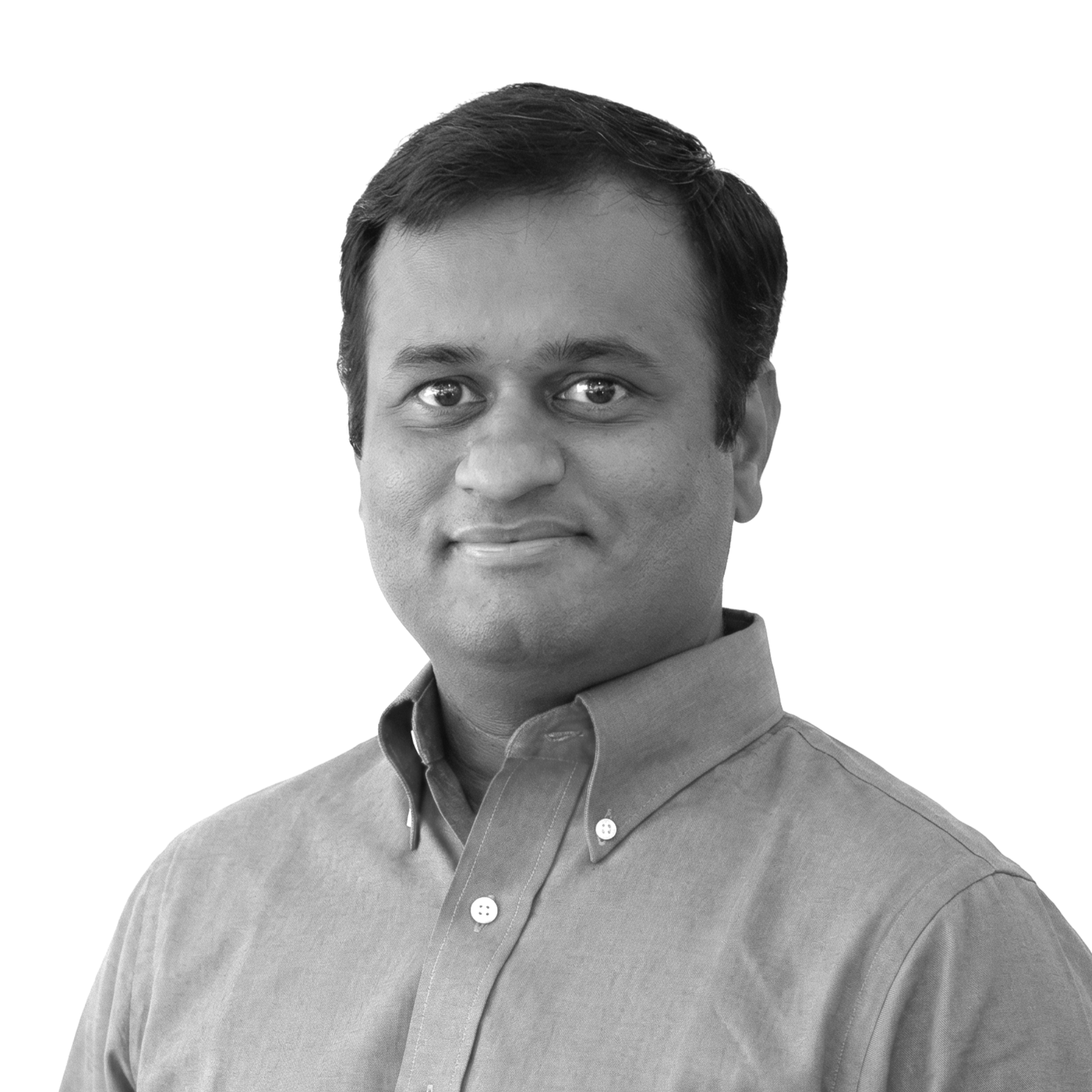 Black and white portrait of a man wearing a button-down shirt, looking at the camera with a slight smile.
