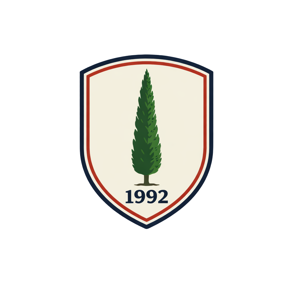 A shield emblem featuring a tall green cypress tree with the year 1992 at the bottom.