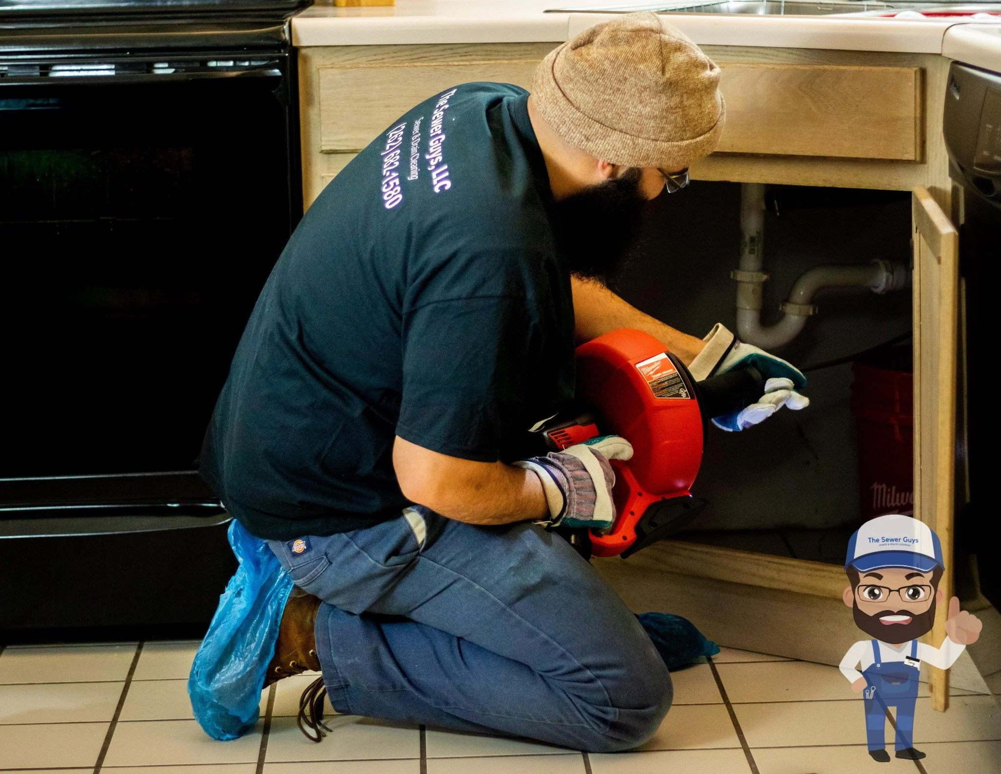 A technician unclogging kitchen sink.
