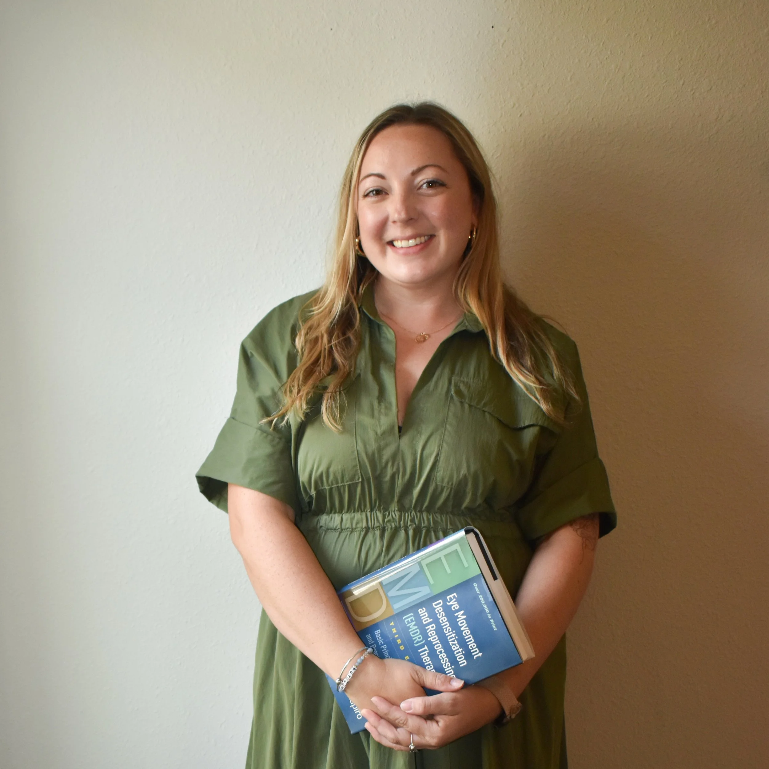 therapist headshot holding EMDR book