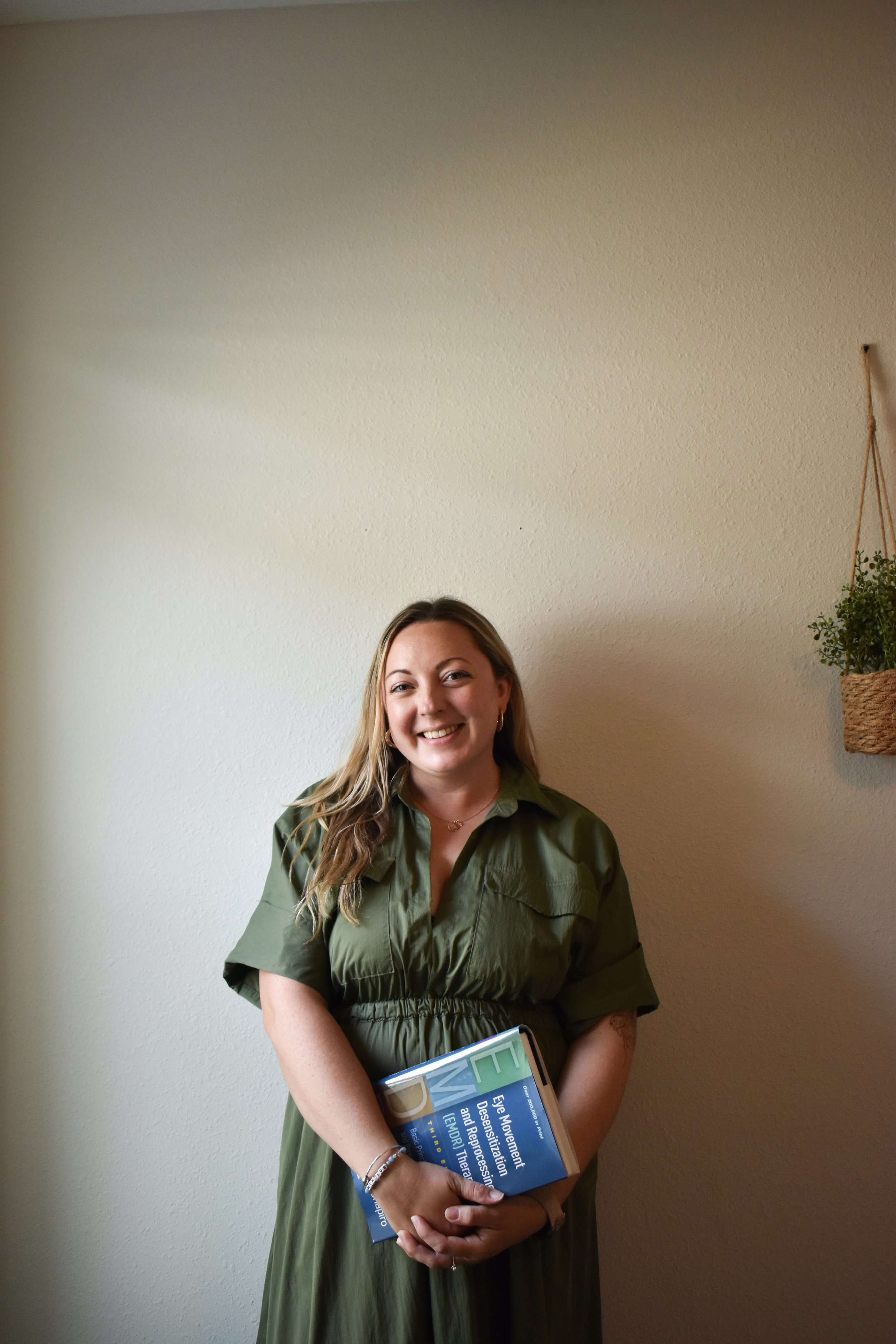 therapist headshot holding EMDR book