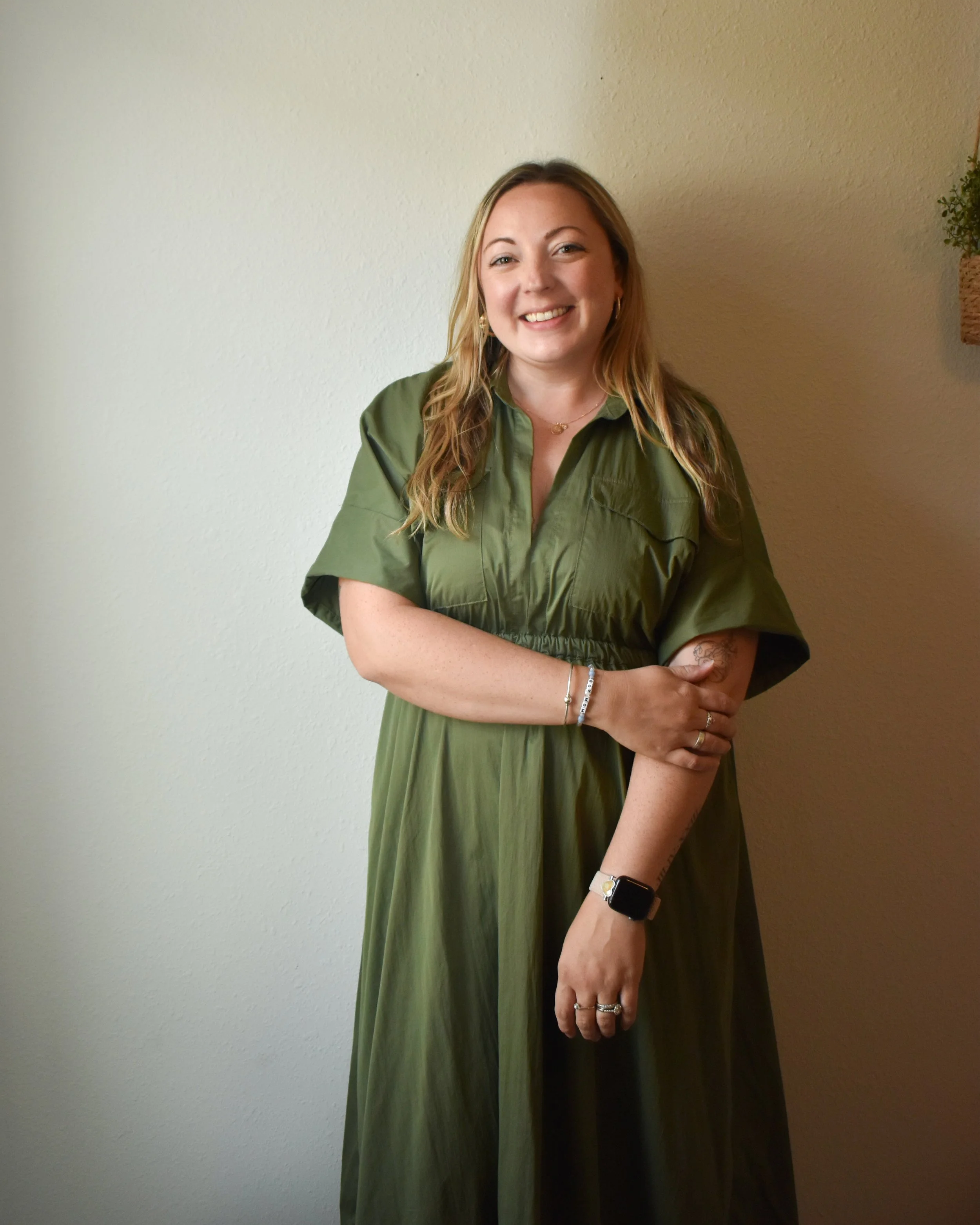 woman in green dress smiling