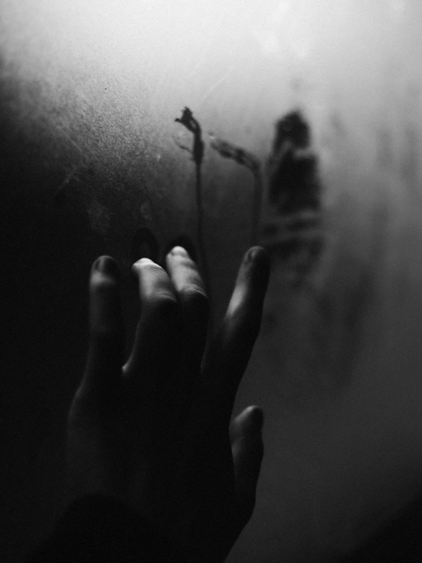 hand drawing on foggy window