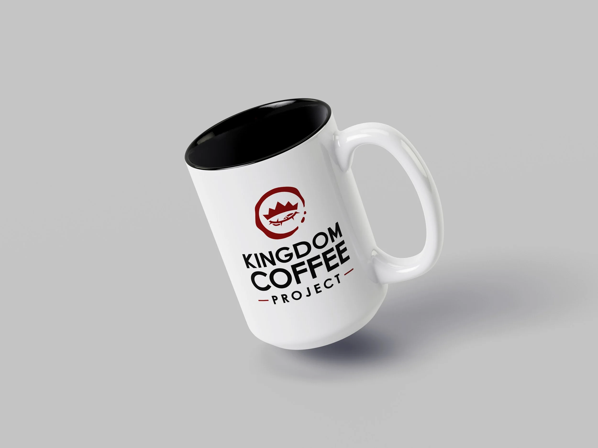 A coffee mug with the logo printed on the side
