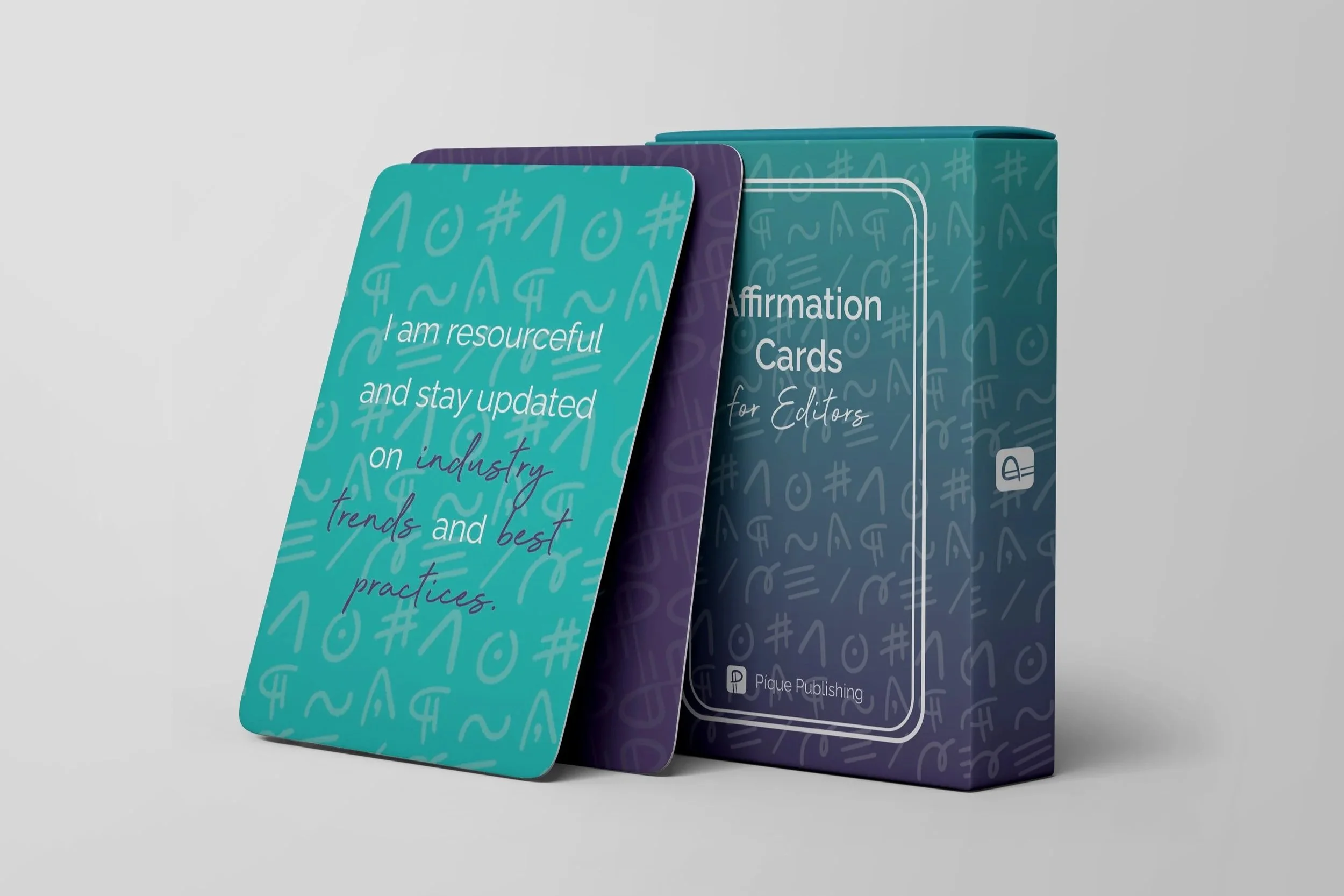 A box with two cards leaned on it to show the designs