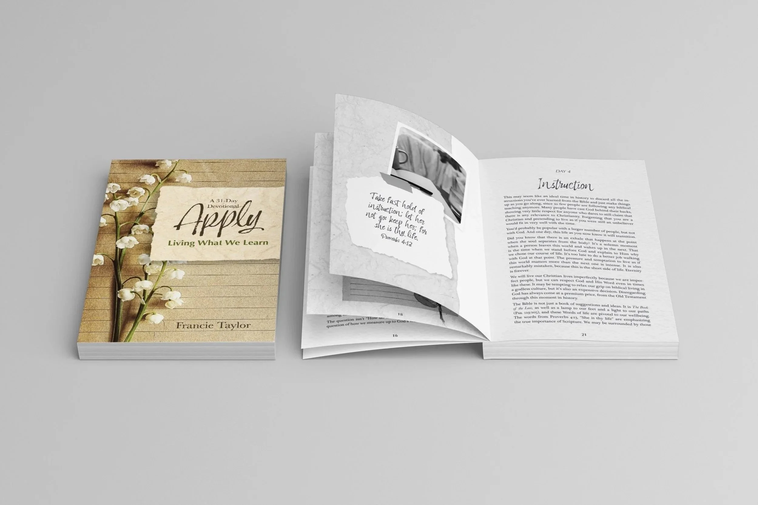 Two copies of the book lying on a flat surface to show the cover and interior designs