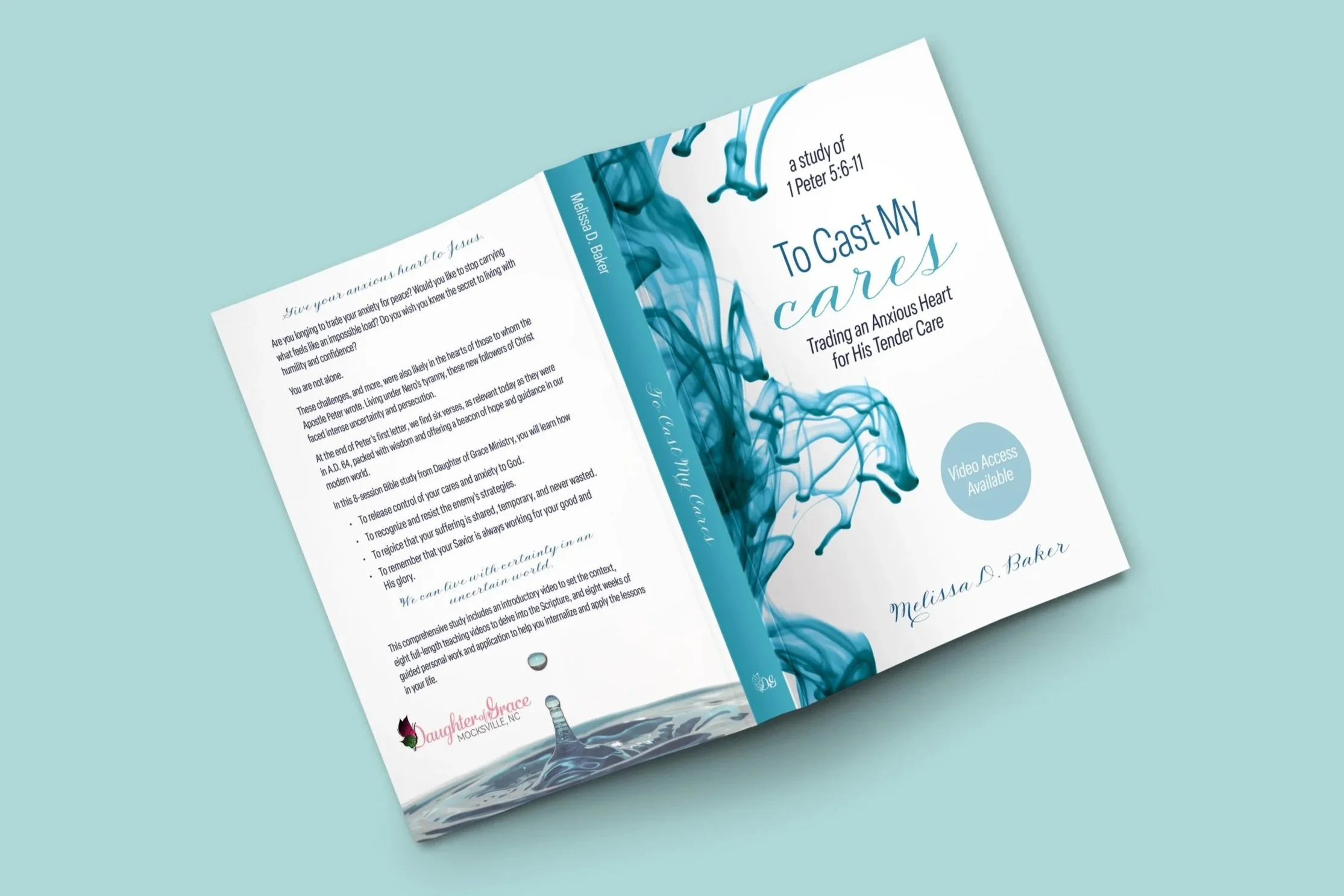 The book opened on a flat surface to show the whole cover design