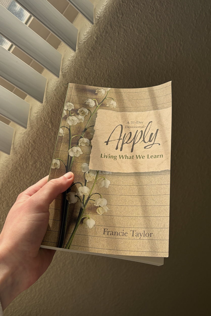 A printed copy of the devotional book project Apply