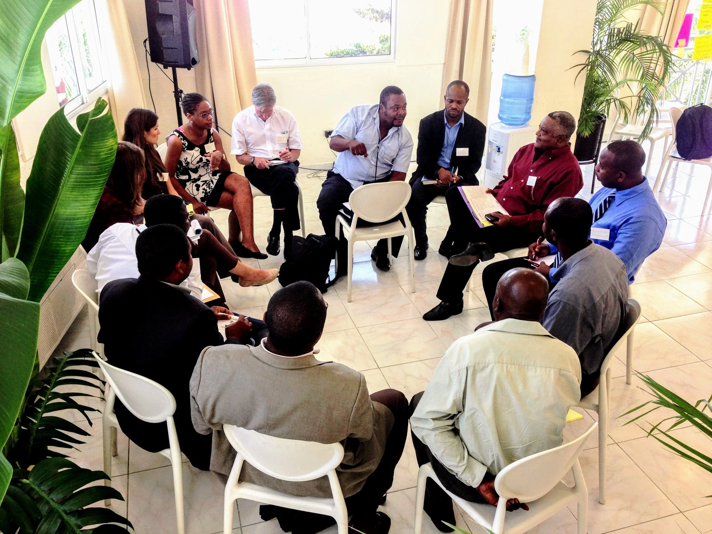 Haitian cooperative leaders in group discussion during an open space meeting in Port au Prince, Haiti