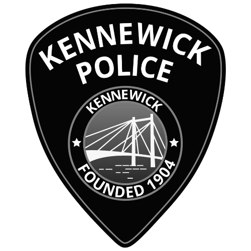 Kennewick Police badge featuring a bridge illustration, the text "Kennewick Police," and the founding year 1904.