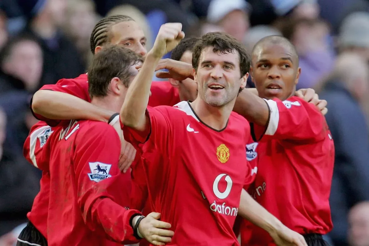 Roy Keane and Manchester United celebrating on the football field.
HNDRX AI