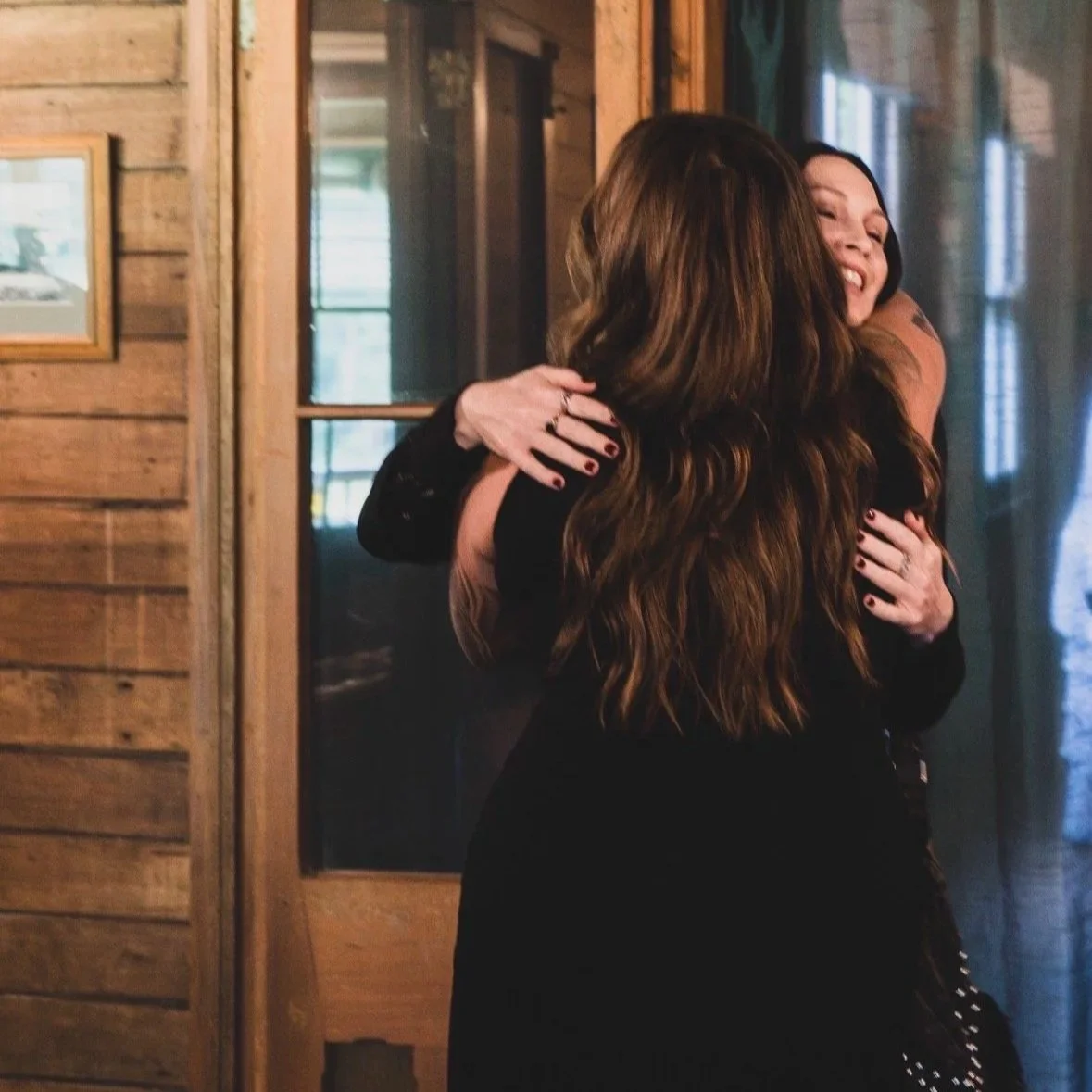 women hugging at the gathering long lunch event