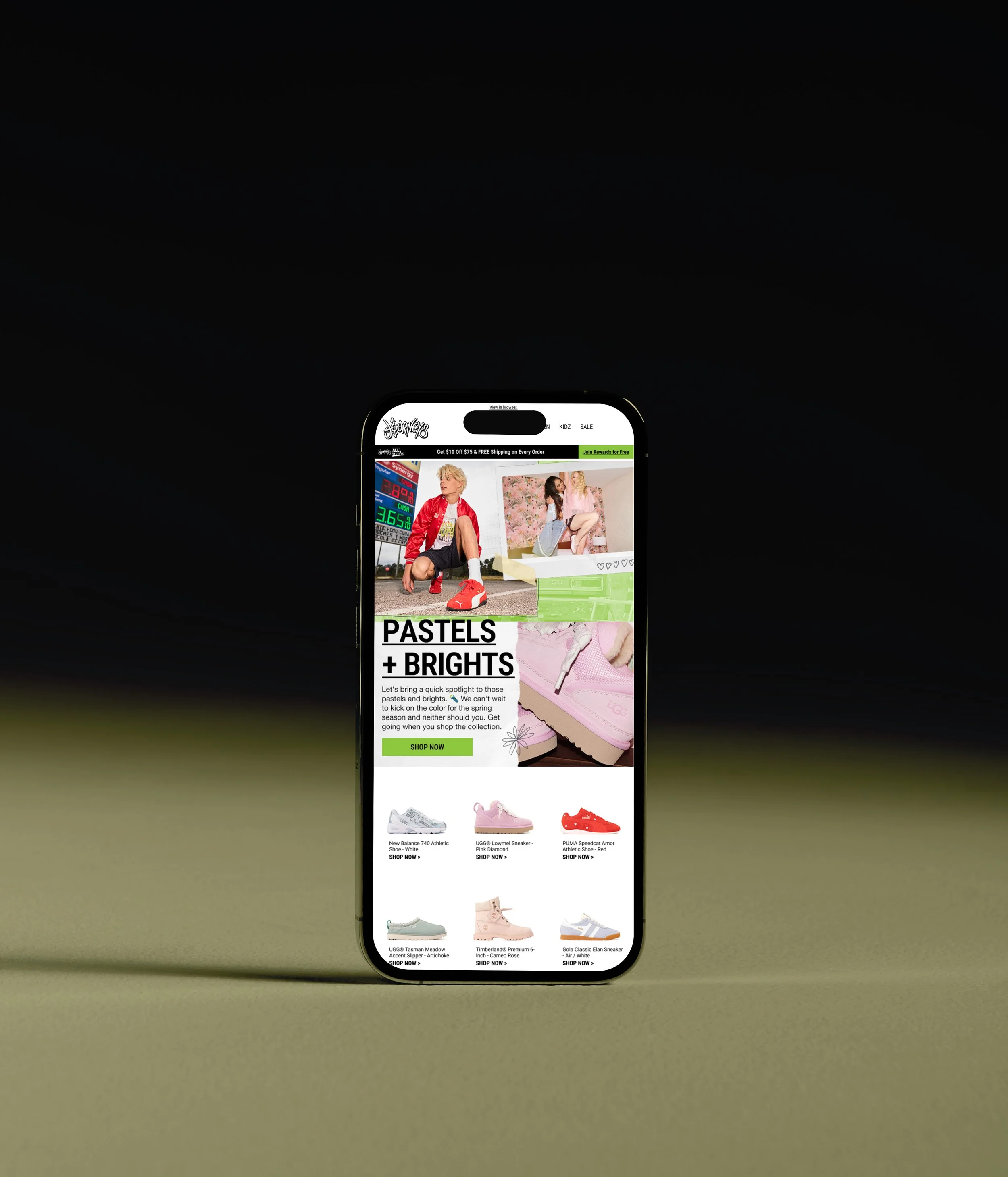 A smartphone displaying a fashion website with models and shoes, against a dark background with a yellow-green gradient surface.