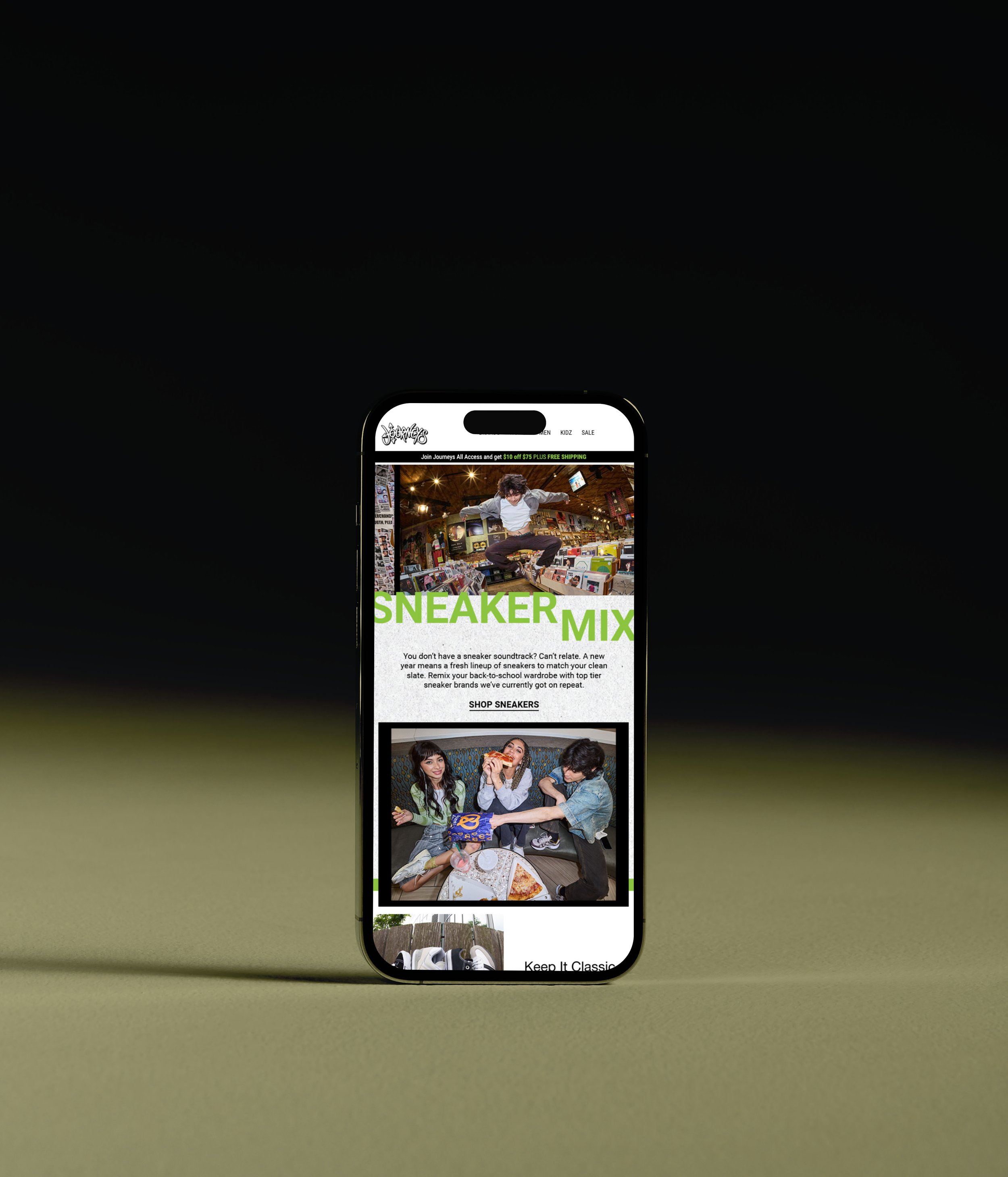 A smartphone displays a website about sneakers and casual fashion, showing a skateboarder jumping inside a store, with women sitting at a table eating pizza.
