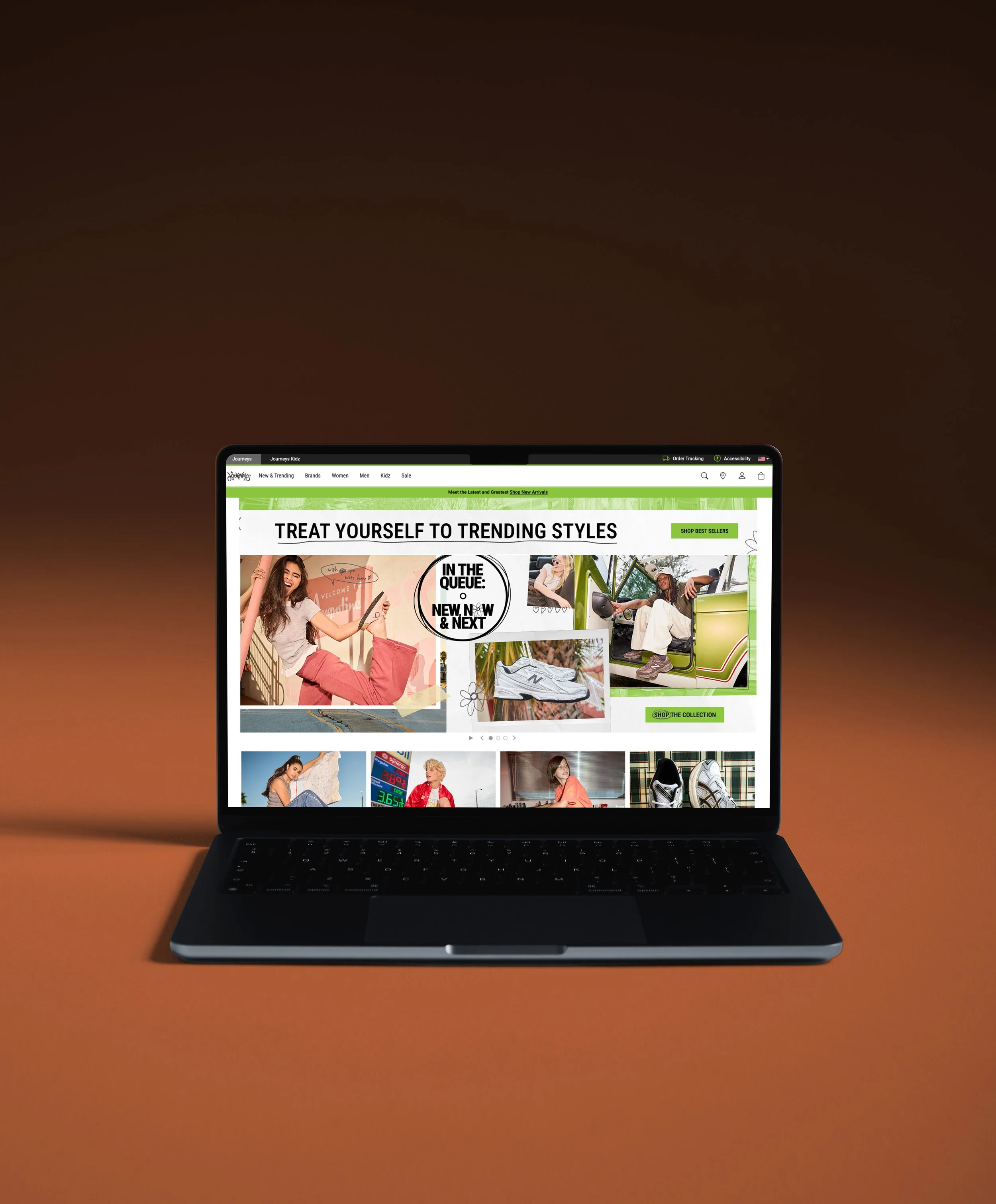 Laptop with online shopping website open on screen, displaying images of people and products, placed on an orange surface.