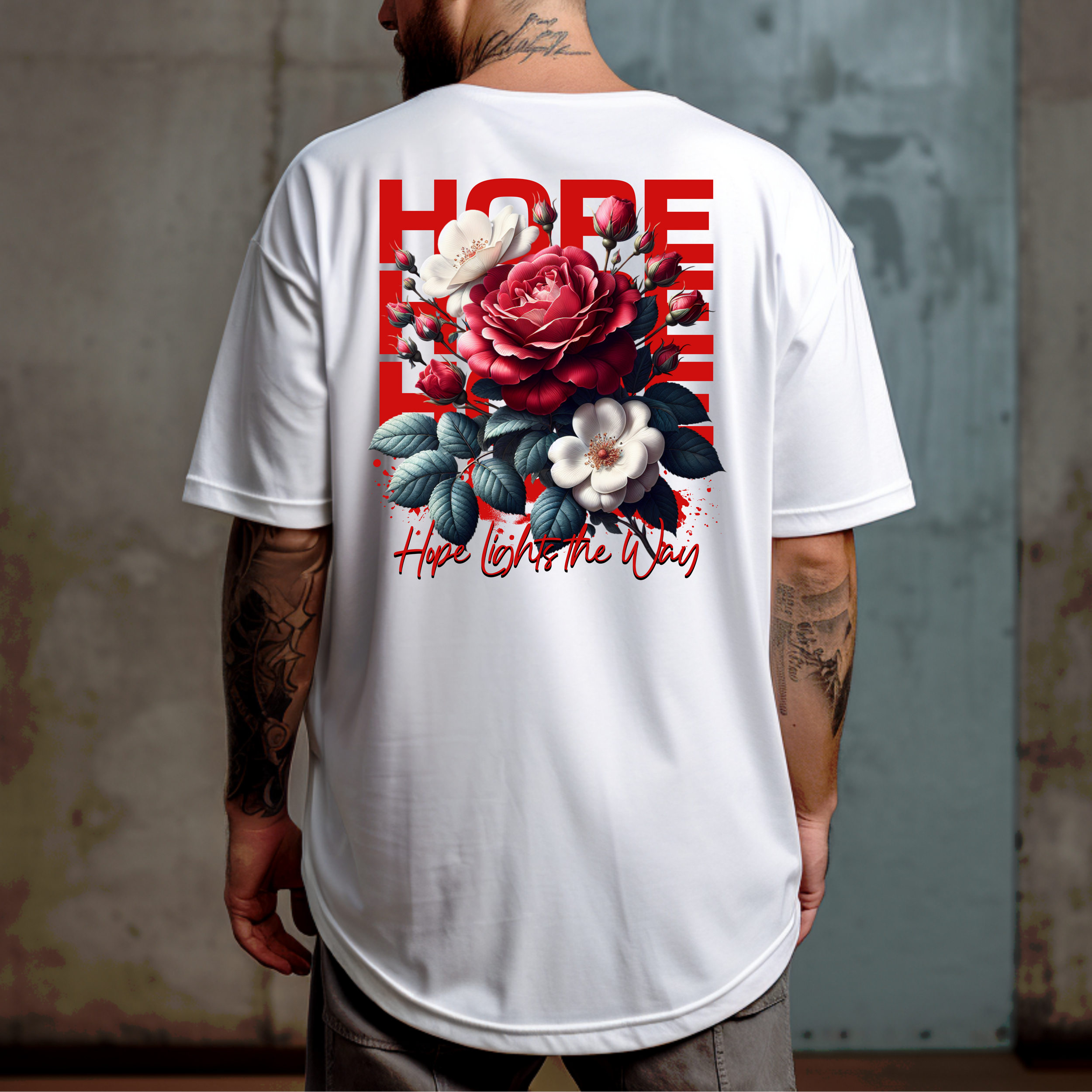 A person wearing a white T-shirt with floral graphics and text saying 'Hope Lights the Way' on the back.
