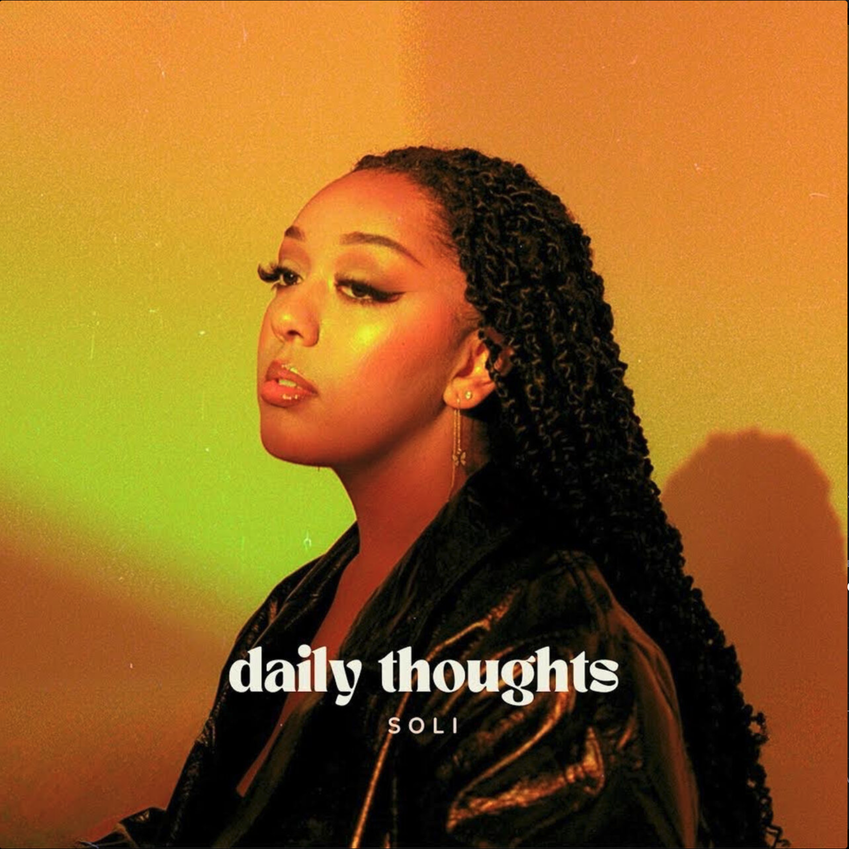 A woman with long braided hair, wearing gold earrings and a black shiny jacket, looking to the side with a neutral expression against a yellow and green gradient background. Text on the image reads 'daily thoughts' and 'SOLI'.
