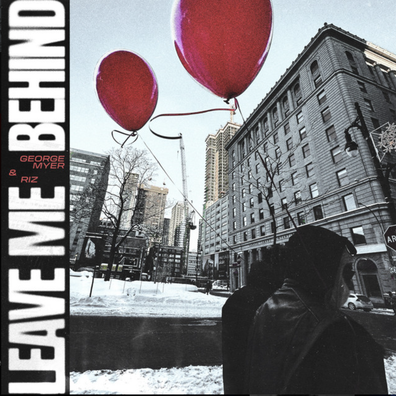 A person holding two red balloons on a city street with tall buildings and snow on the ground. George Myer, RIZ
