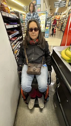 Person in mobility scooter unable to reach payment terminal