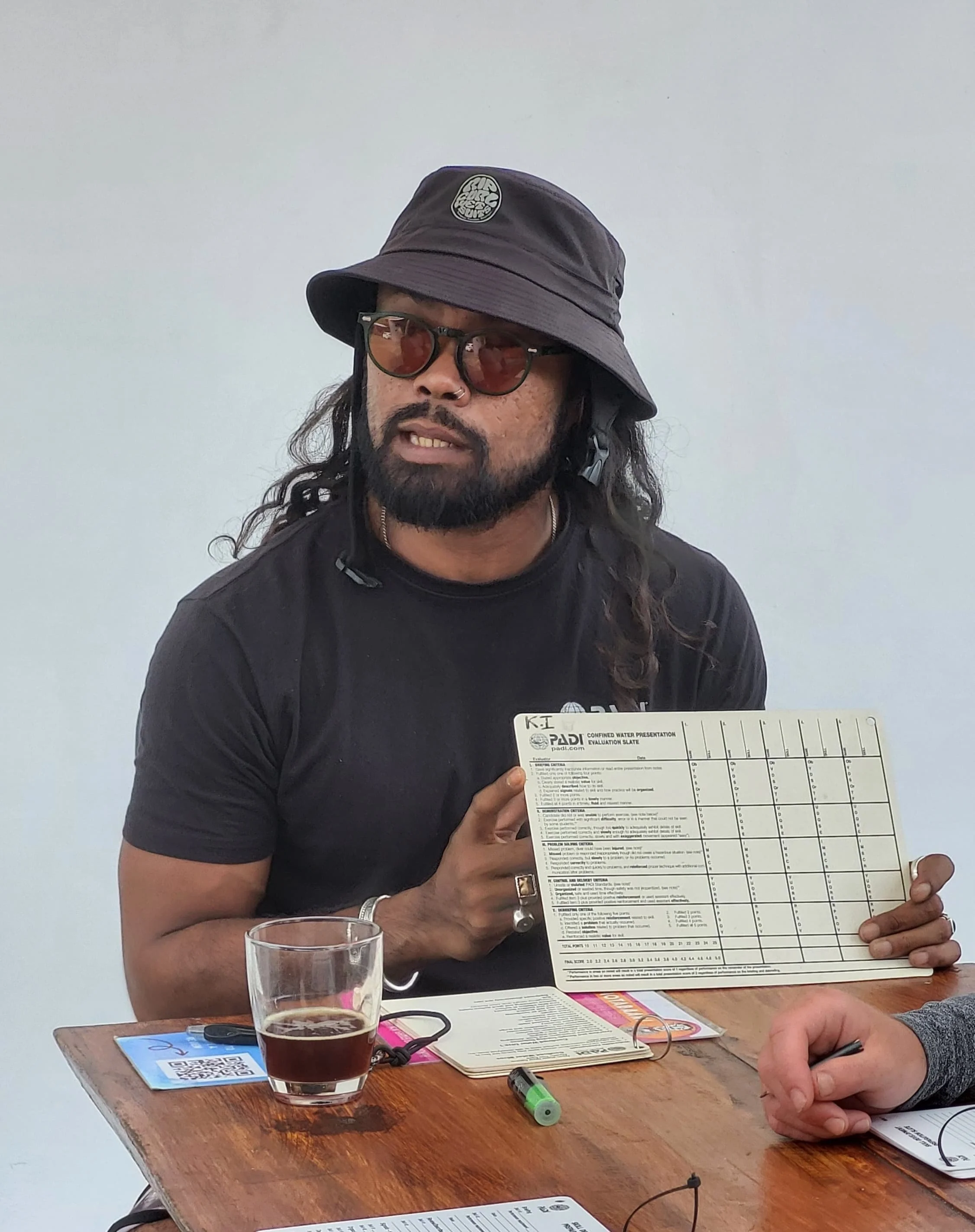 PADI Course Director reviewing instructor evaluation during IDC training