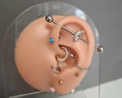 Industrial piercing bar with attachement