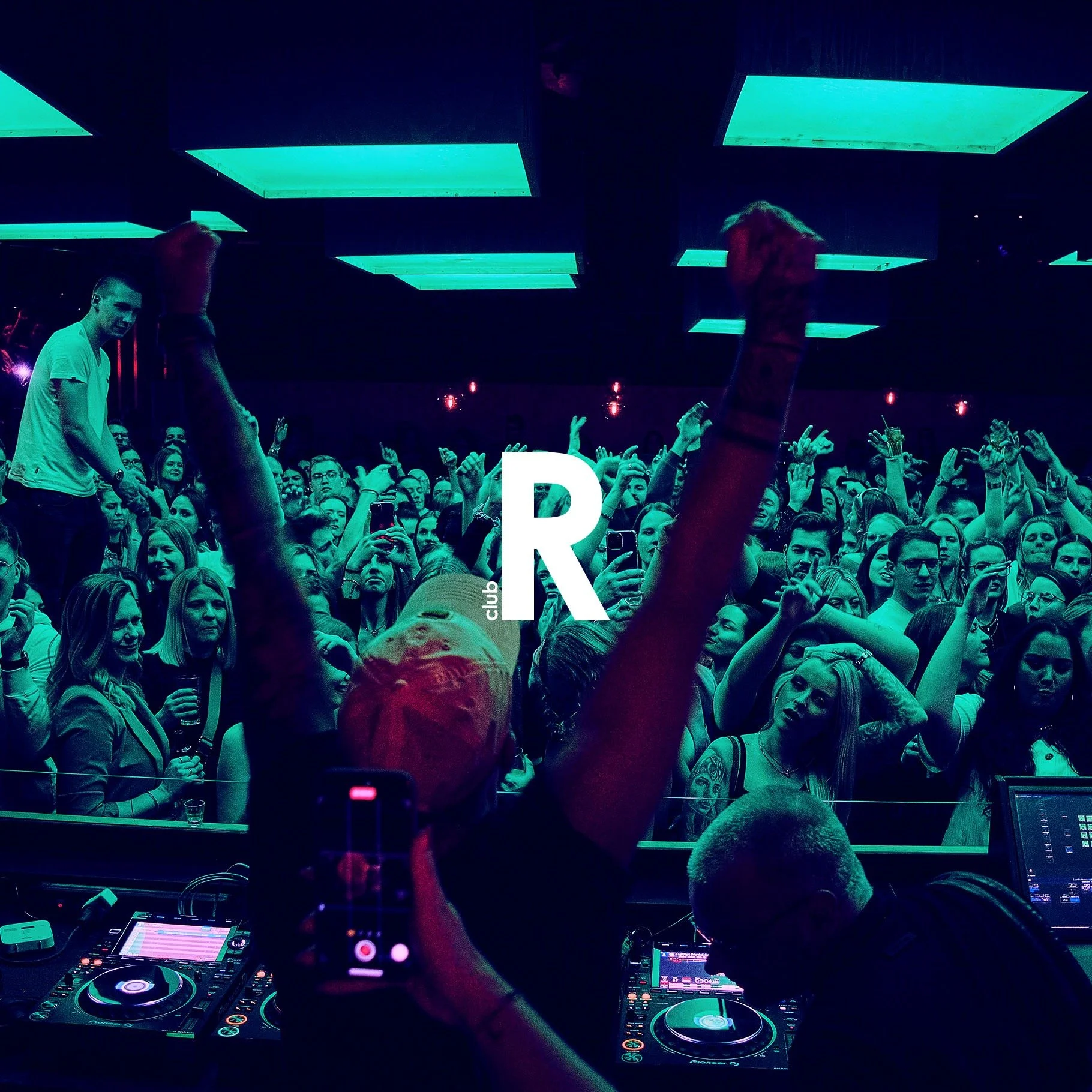 Residenz Paderborn Club. Crowd at a nightclub dancing and taking photos, DJ in the foreground, teal and purple lighting, large letter R with club label overlay.