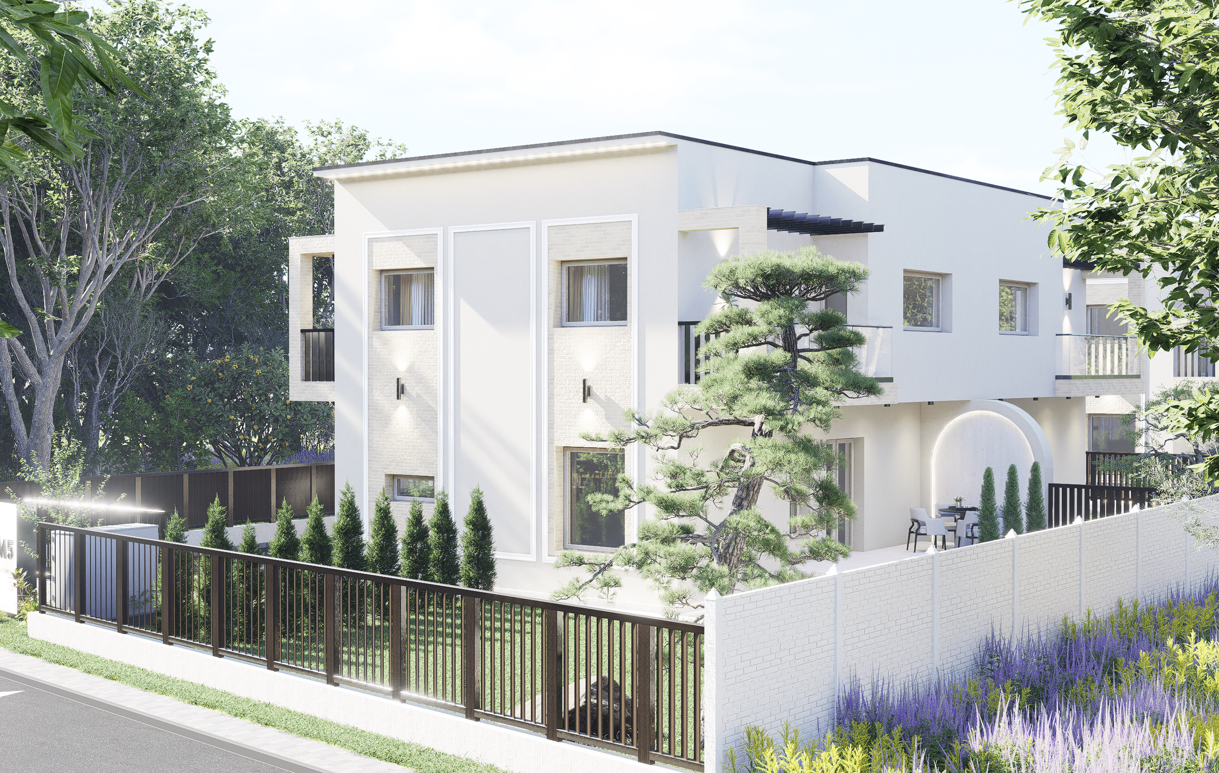 Modern white two-story house with minimalist design, surrounded by greenery, small trees, and a black metal fence, with an outdoor dining area.