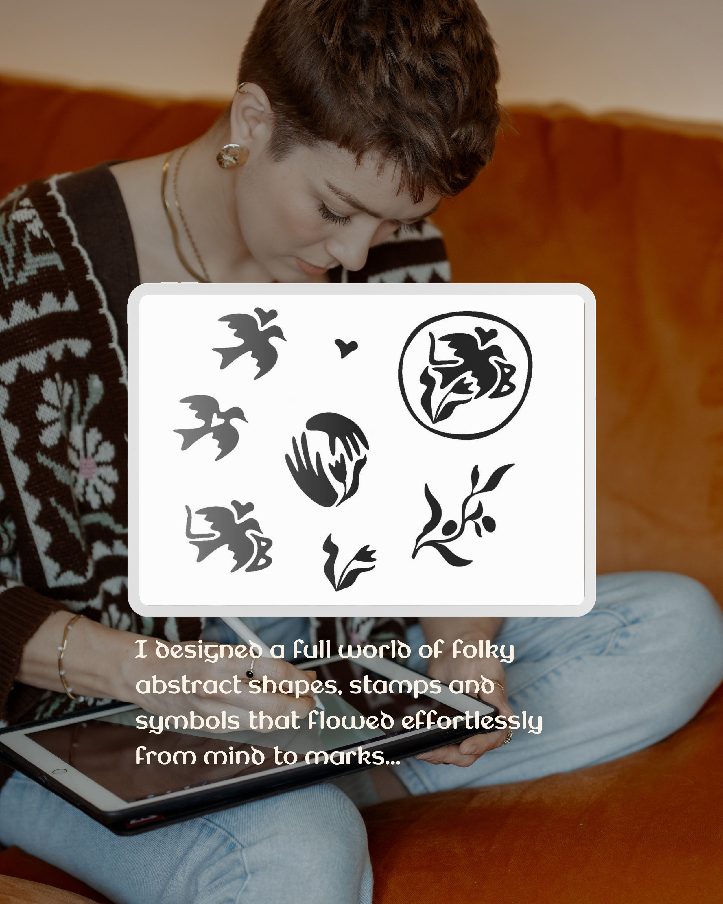 Person sitting on a brown couch, holding a tablet, wearing a patterned sweater, light blue jeans, and gold jewelry. There is a white square overlay with black folk art-style drawings of various shapes and symbols and a caption that reads: "I designed