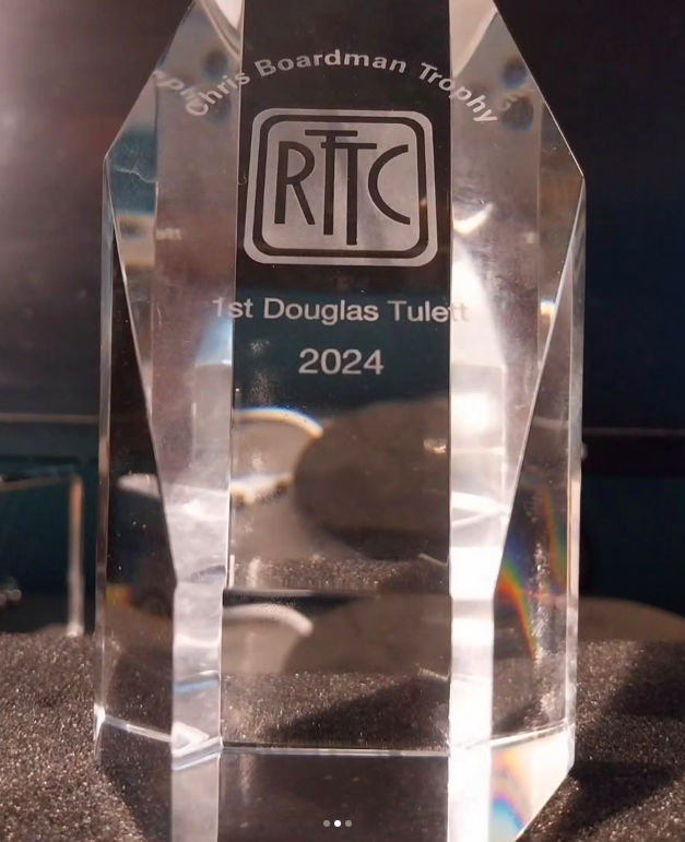 A glass award with the inscription "Chris Boardman Trophy" at the top, followed by the RTC logo, then "1st Douglas Tullet" and the year "2024".
