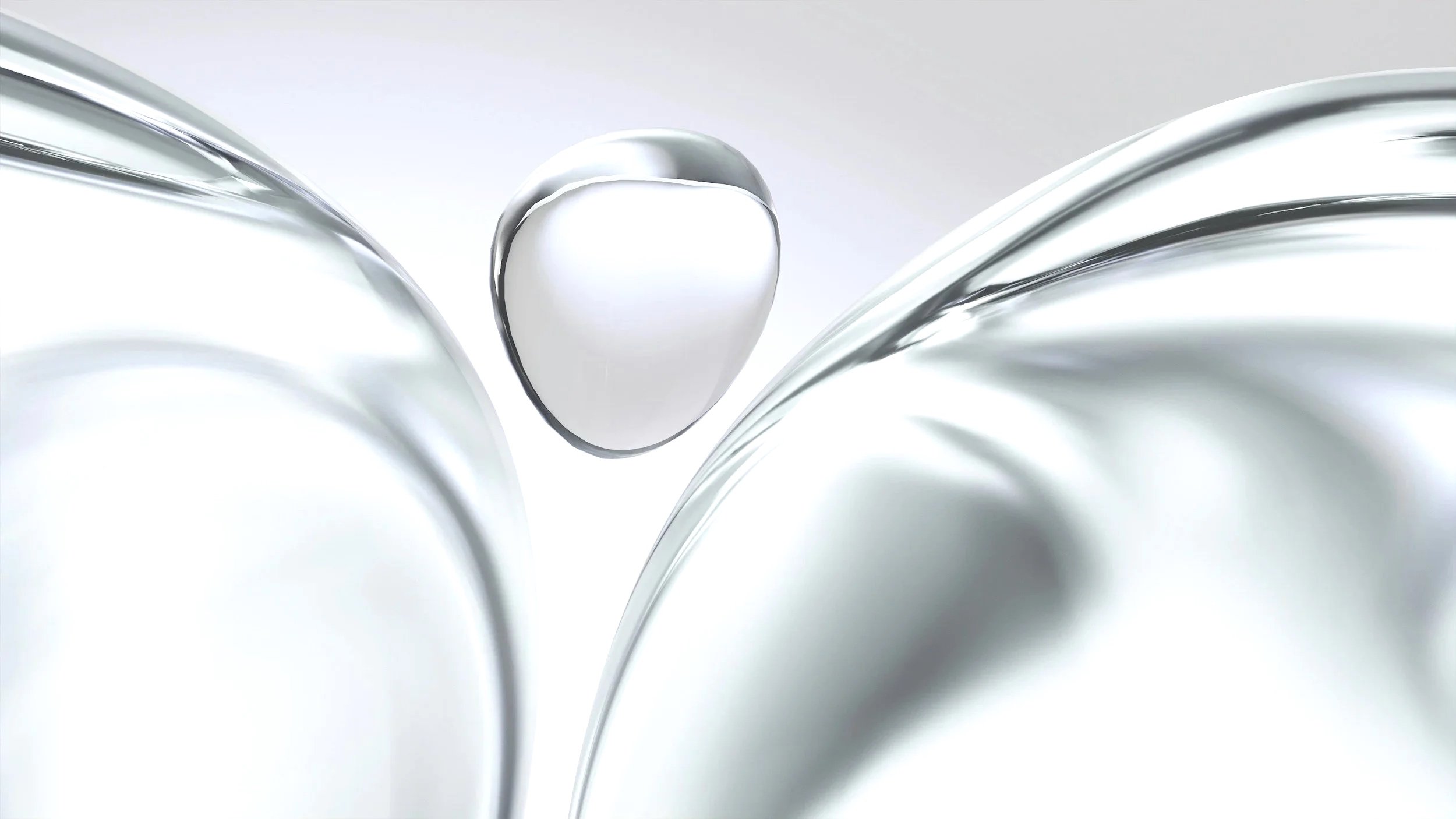 Close-up of metallic, abstract sculptures with smooth, reflective surfaces and curved shapes.