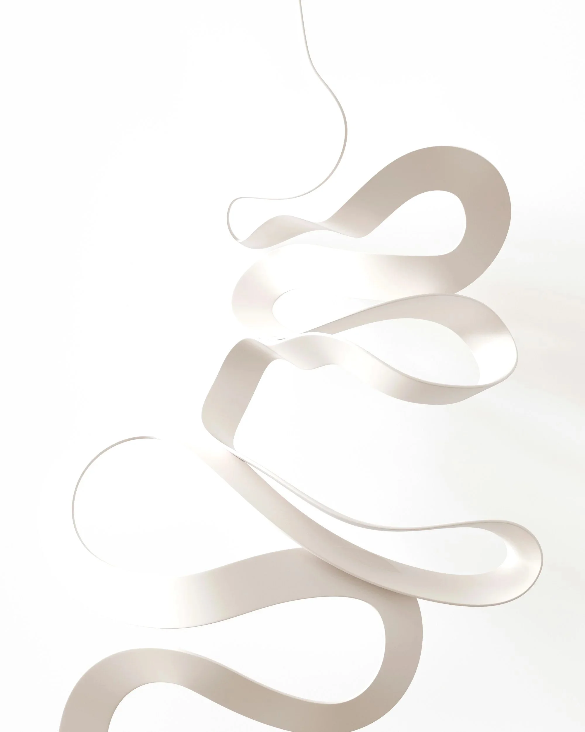 Abstract white sculpture with flowing, ribbon-like curves against a white background.