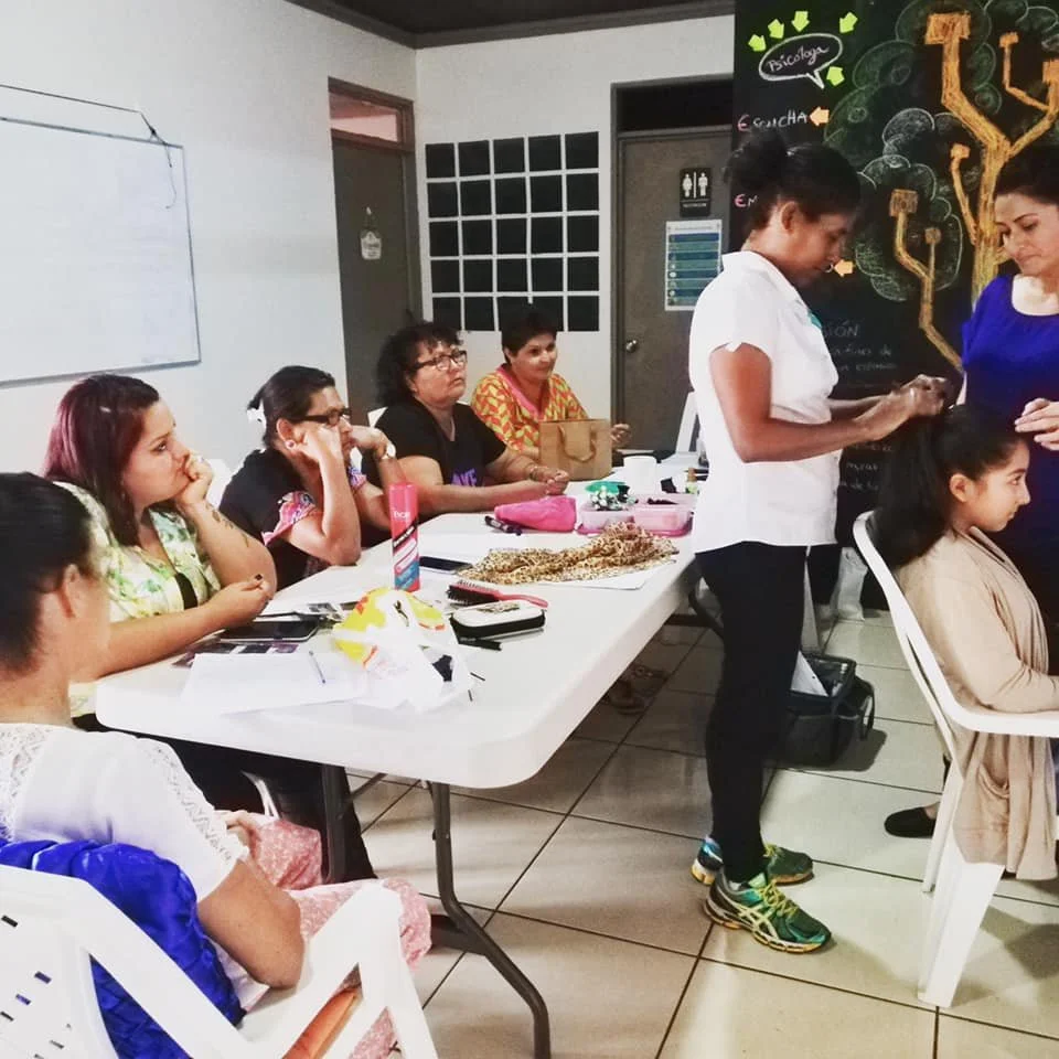 Women learn how to style hair!