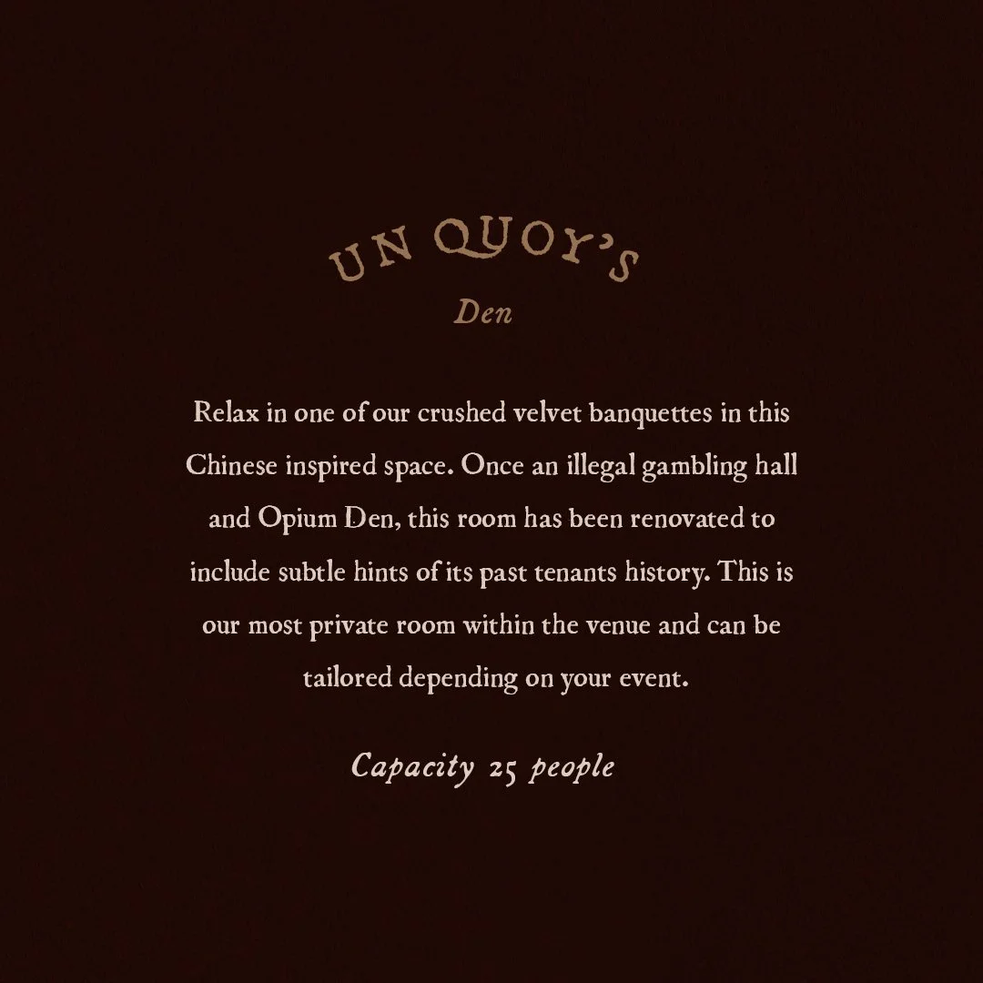 Sign for UN Quoy's Den describing it as a Chinese-inspired space with velvet banquettes, a renovated room with hints of past history, and a capacity of 25 people.