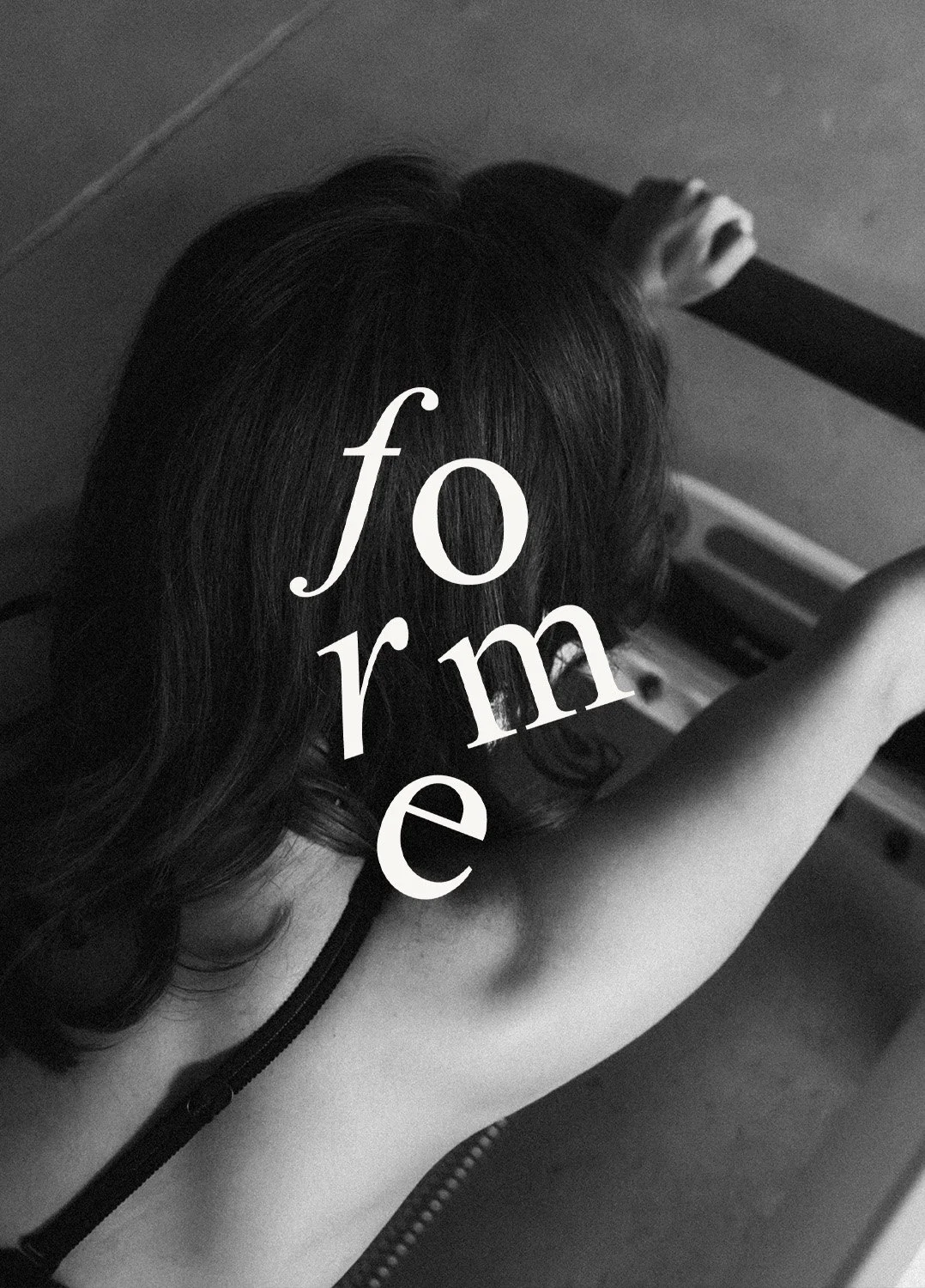 Black and white photo of a woman with dark hair. She is reaching up with her right arm, and the word 'for me' is superimposed over her head in white, stylized text.