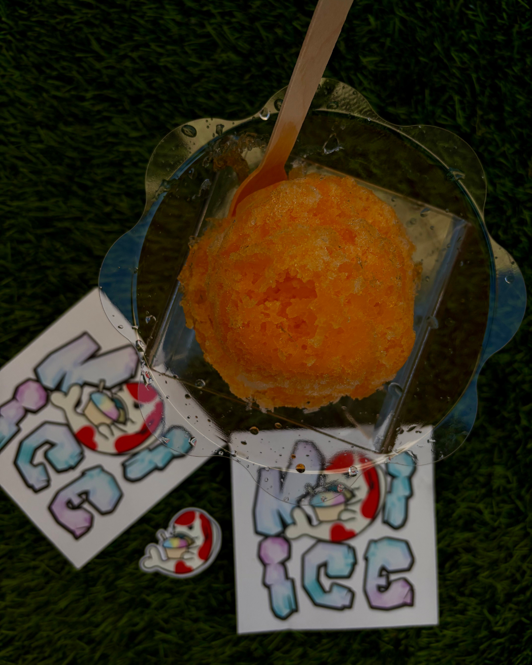 Multiple shaved ice flavors displayed in clear cups for a festival crowd