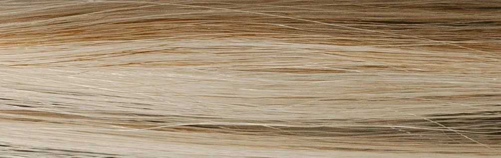 Close-up of a wooden surface or plank with natural grain patterns.