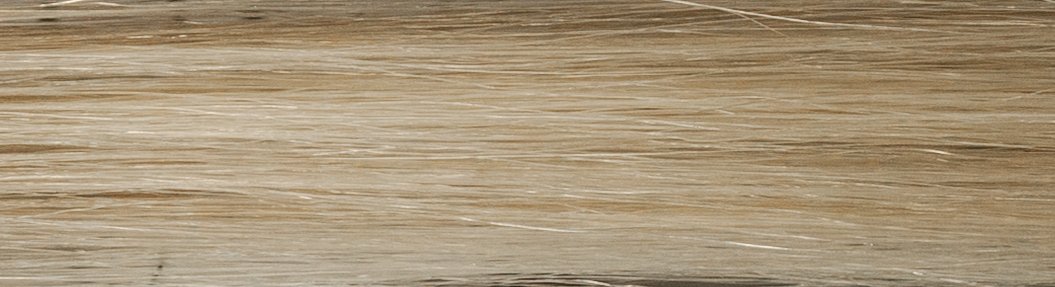 Close-up of a light-colored wooden surface with visible grain patterns.