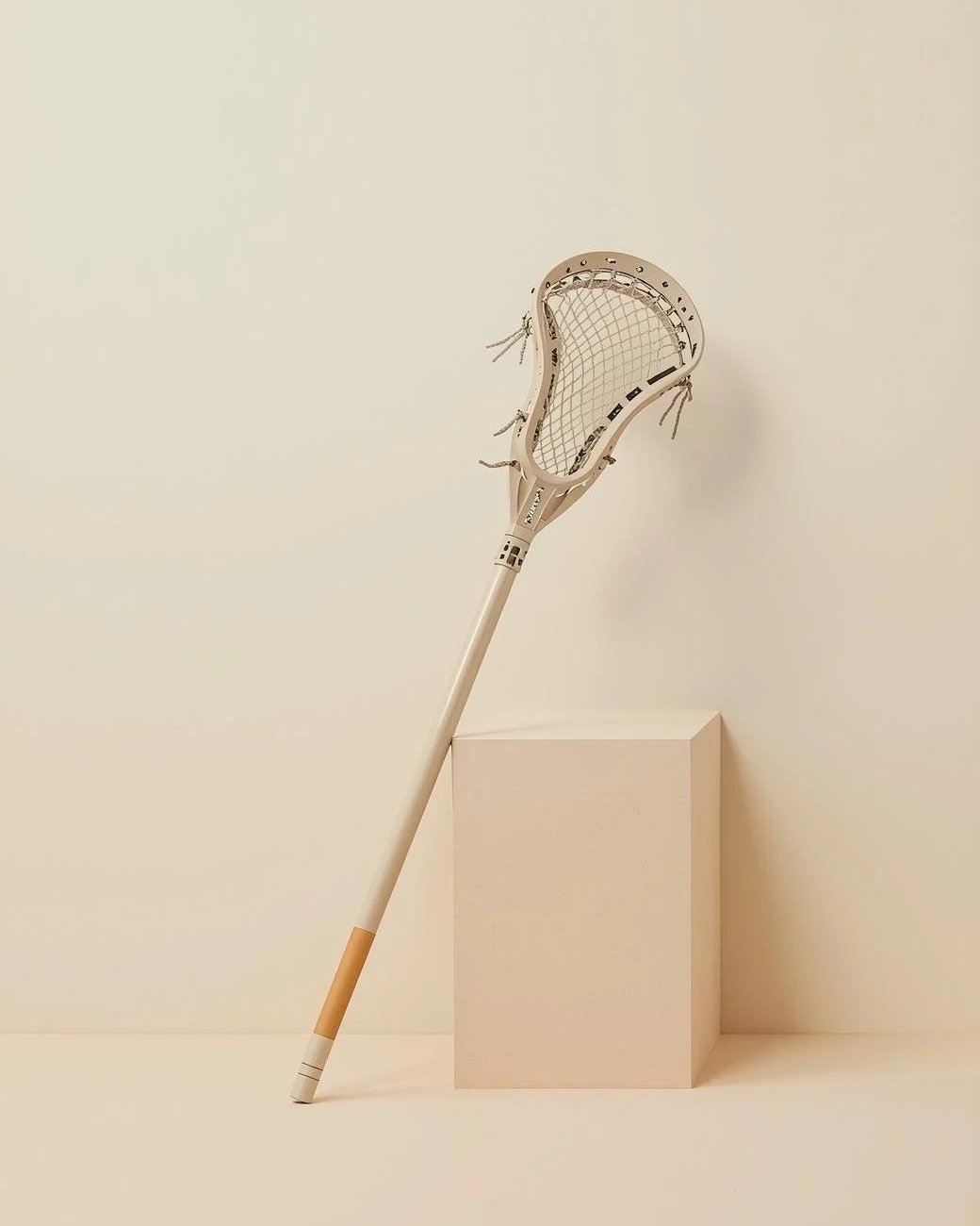 a lacrosse bat leaning on a block